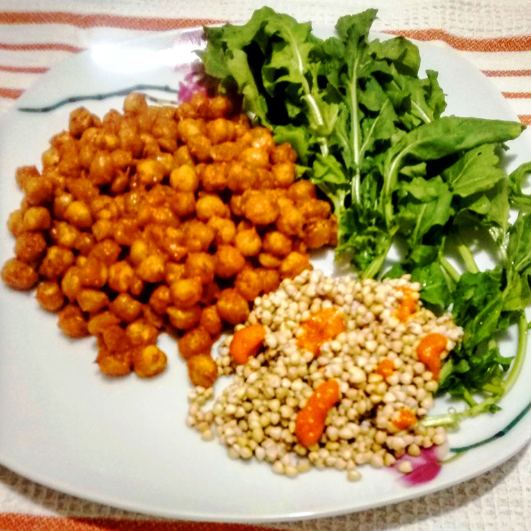 Chickpeas with homemade red pepper sauce served with buckwheat