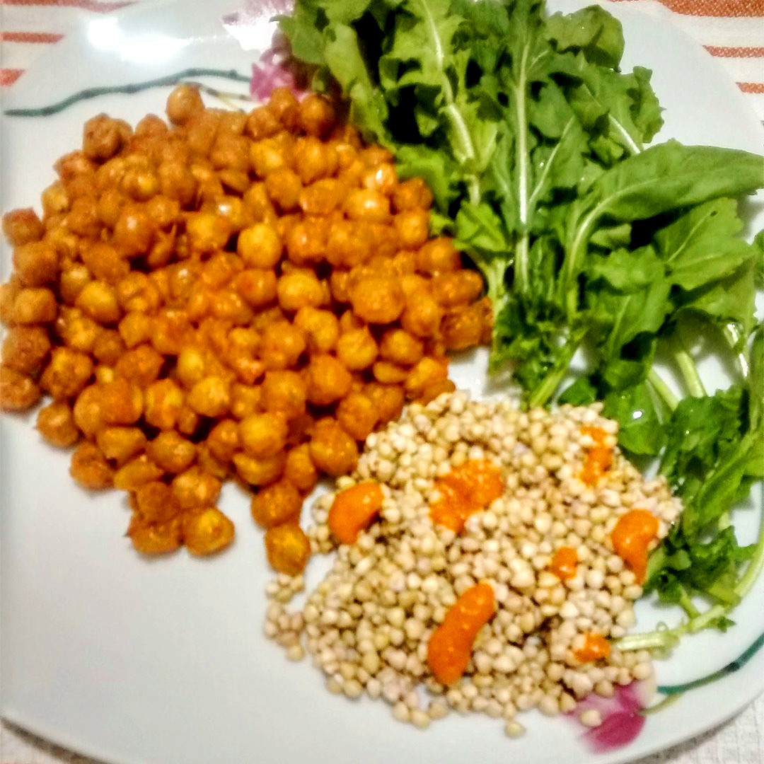Chickpeas with homemade red pepper sauce served with buckwheat